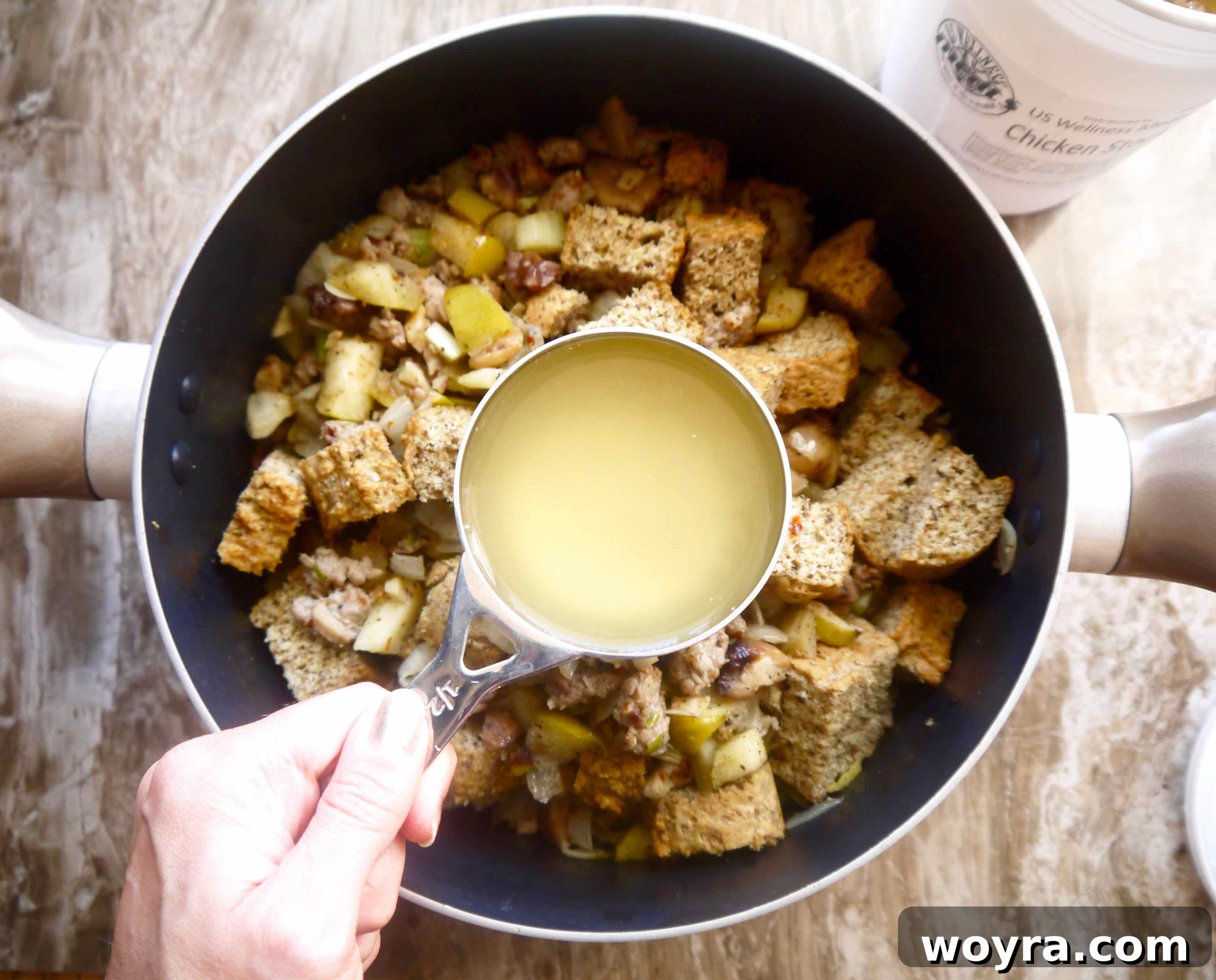 The complete Paleo stuffing mixture being combined in a large pan before baking.