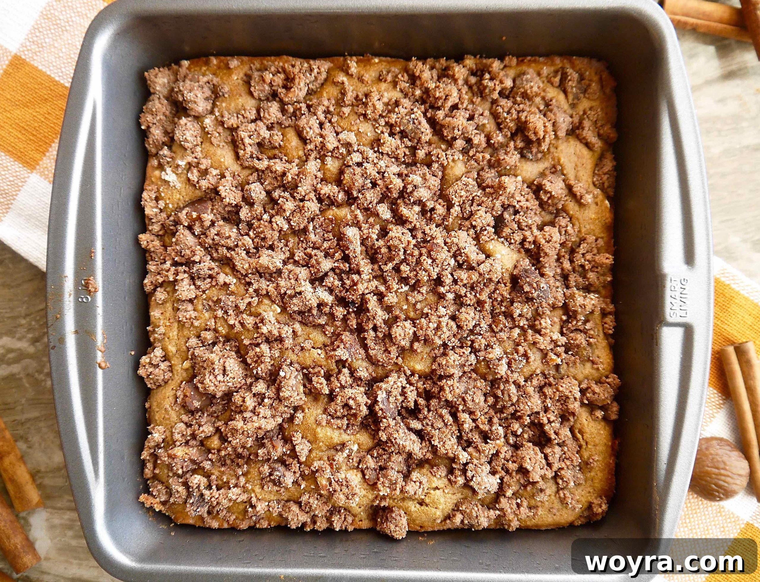 Rustic Chestnut Flour Coffee Cake 9 A freshly baked chestnut flour coffee cake with a golden-brown crumb topping, removed from the oven.