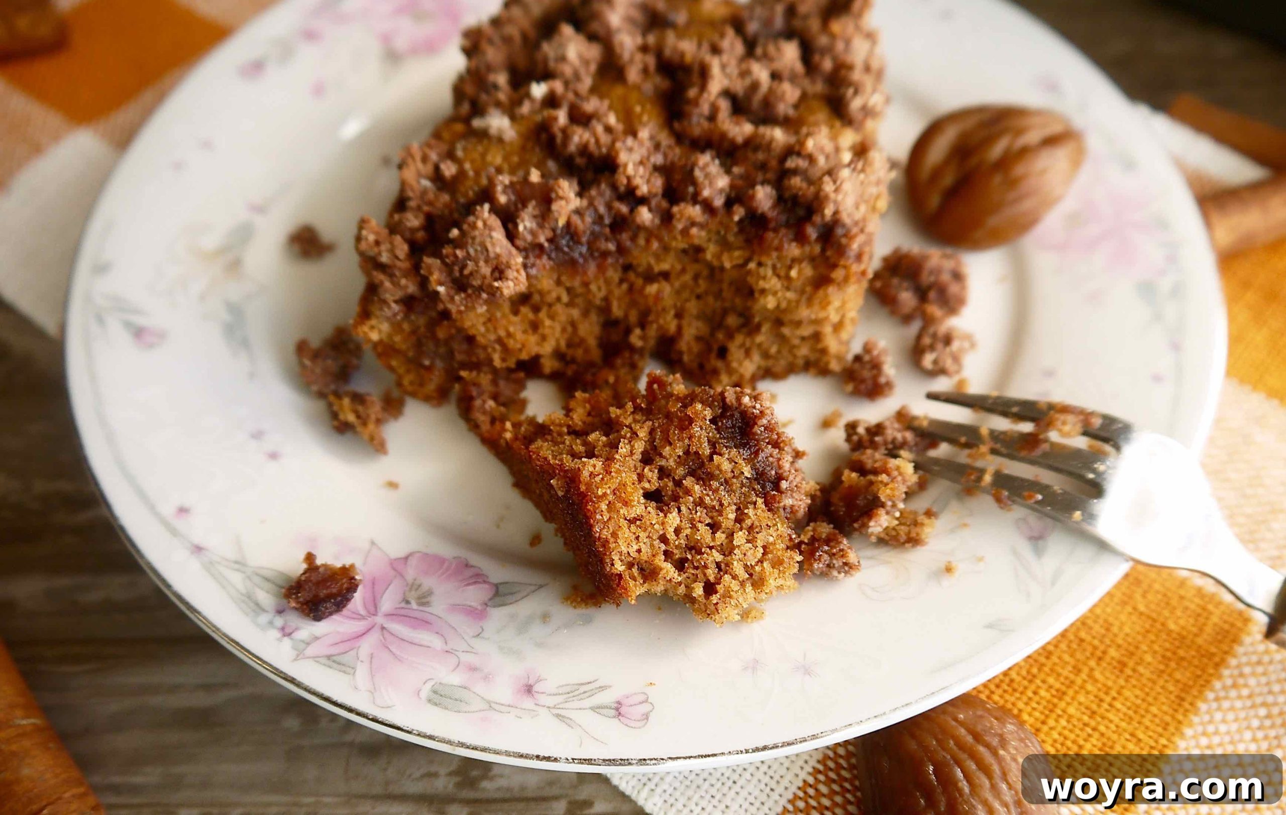 Rustic Chestnut Flour Coffee Cake 10 A slice of Paleo Chestnut Flour Coffee Cake with a bite taken out, showcasing its moist interior and delicious crumb topping.