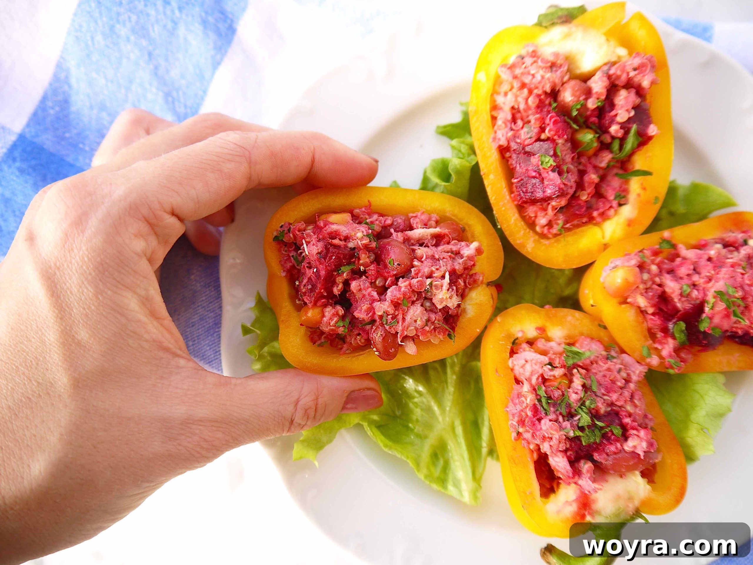 Vibrant Quinoa Beet Tuna Salad 9 Bright red and yellow bell peppers generously stuffed with the Quinoa Beet Tuna Salad, arranged on a serving platter, ready to be enjoyed.