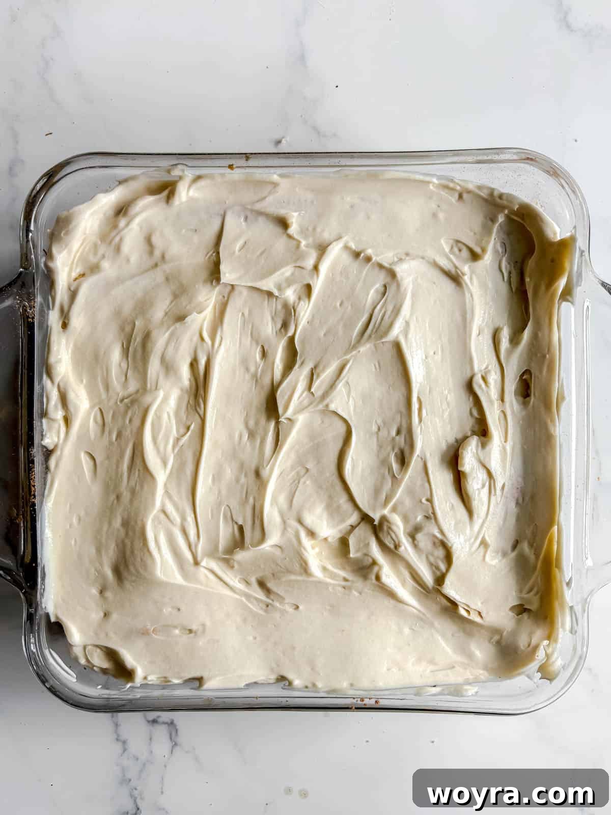 Tropical Coconut Tiramisu 11 Second layer of mascarpone and coconut cream mixture spread over the second layer of ladyfingers.