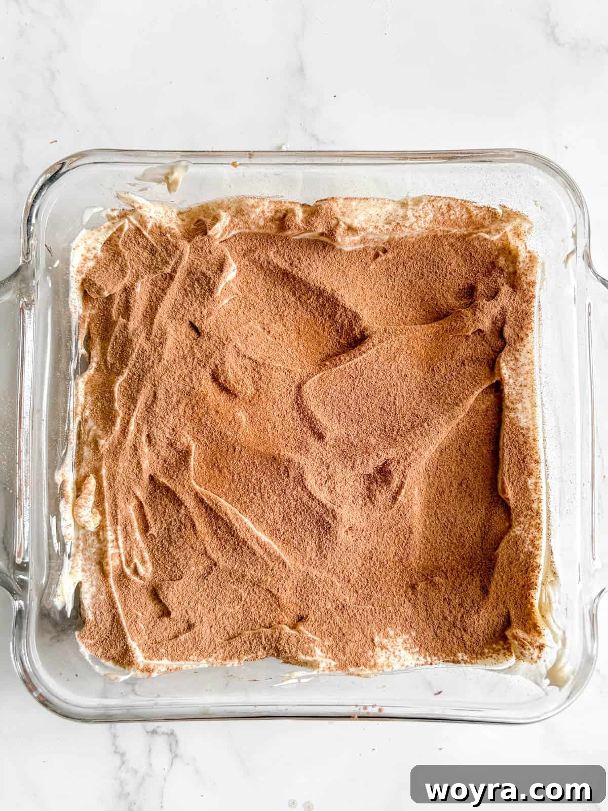 Tropical Coconut Tiramisu 9 First layer of mascarpone and coconut cream mixture spread over ladyfingers.