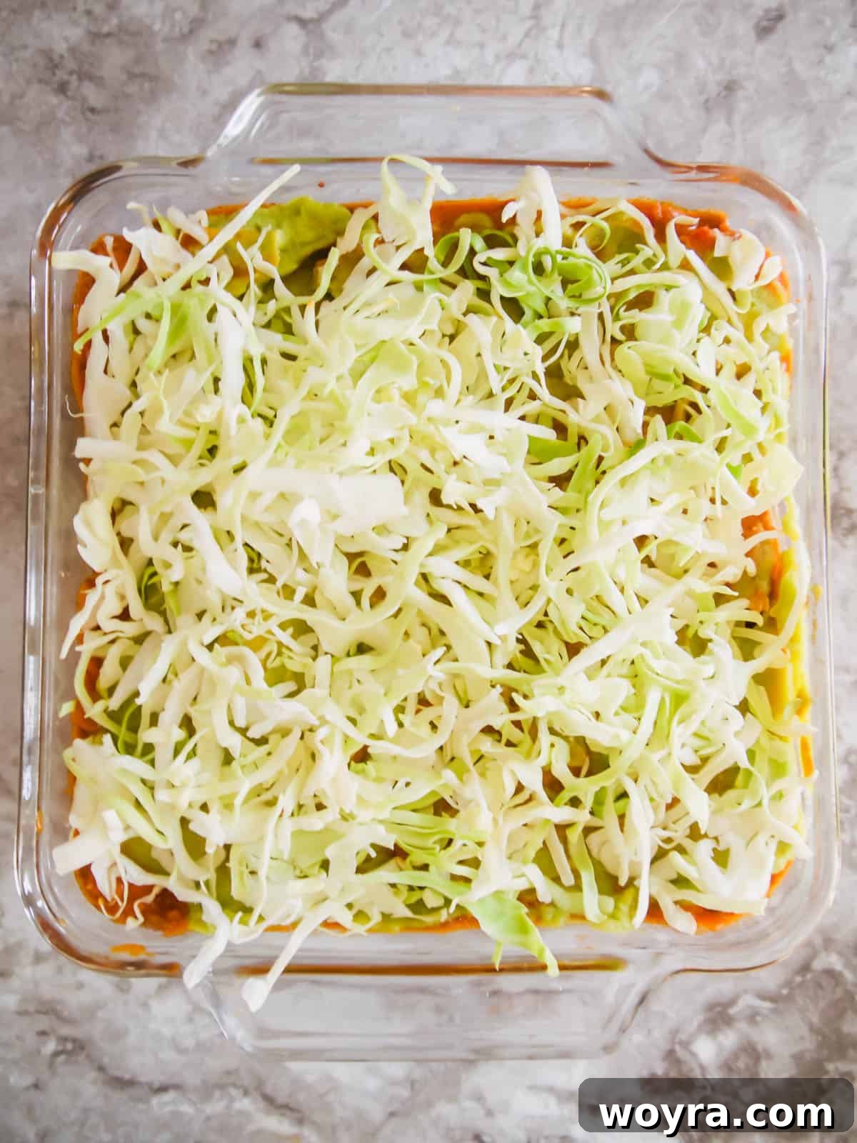 Ultimate Dairy-Free 7 Layer Turkey Taco Dip 11 Shredded lettuce layer added to the dip.