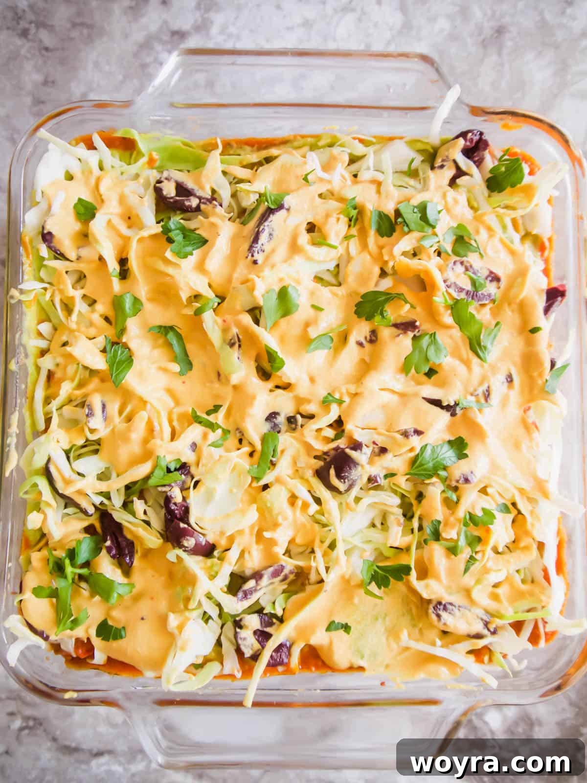 Ultimate Dairy-Free 7 Layer Turkey Taco Dip 12 Dairy-free queso and black olives added as the final layers to the dip.