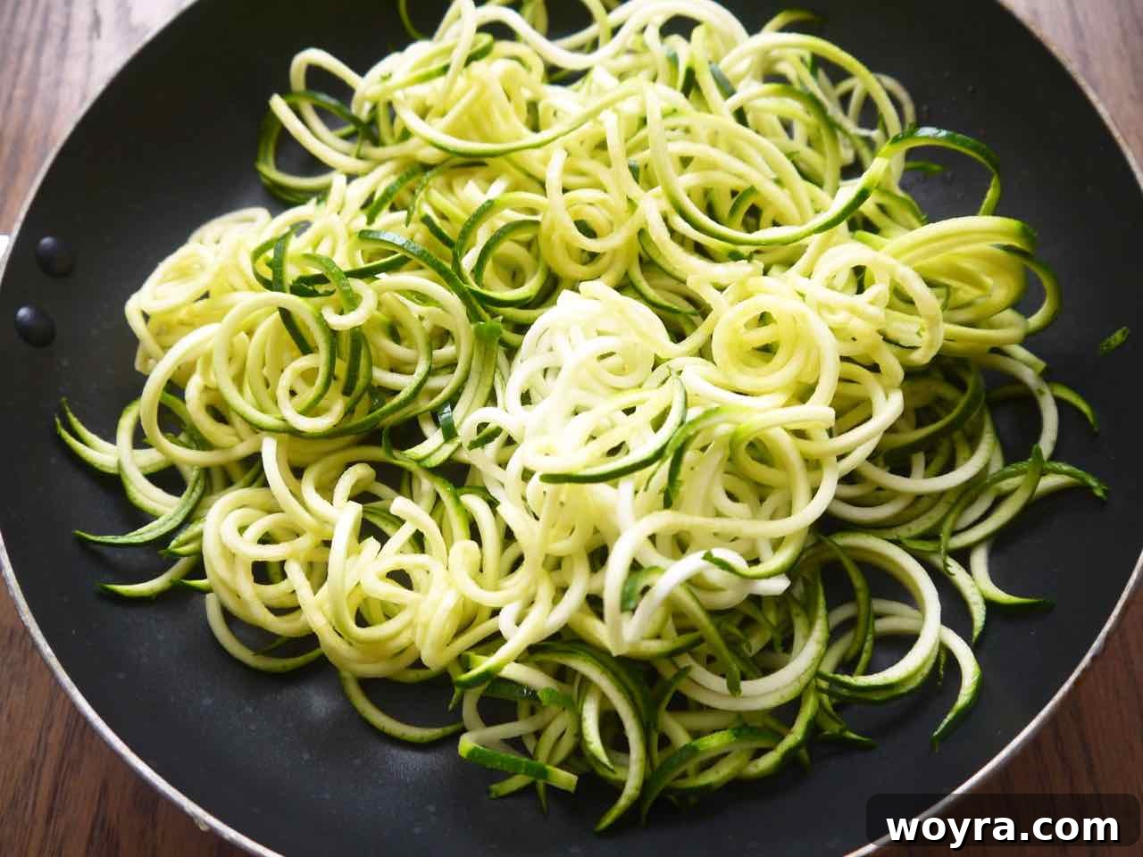Spiralized zucchini noodles ready for cooking.
